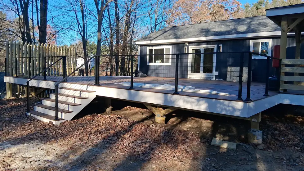 Cable railing on an elevated composite deck with steel stairs