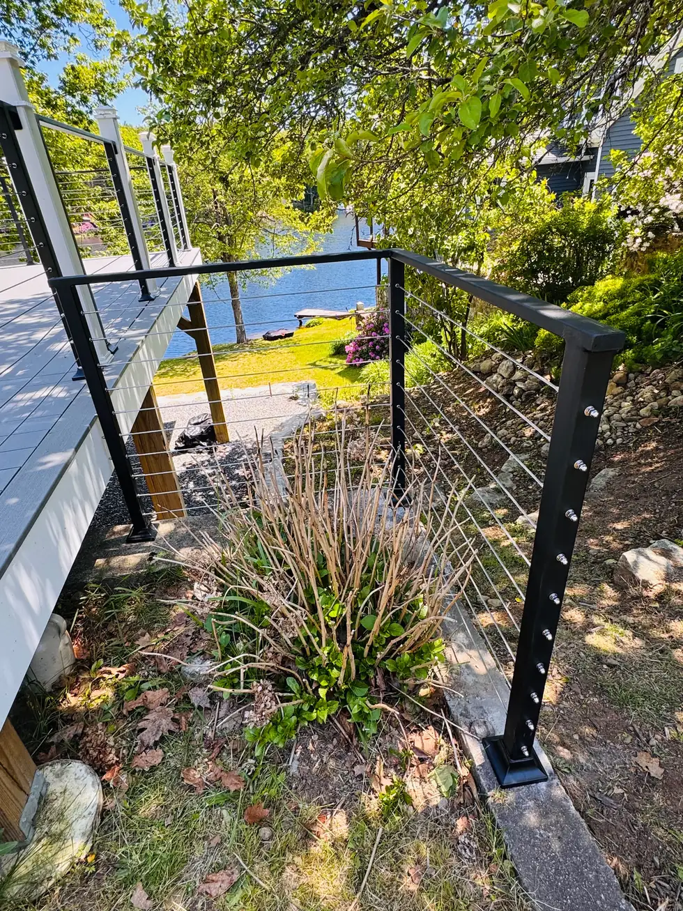 Cable railing on a waterfront garden slope