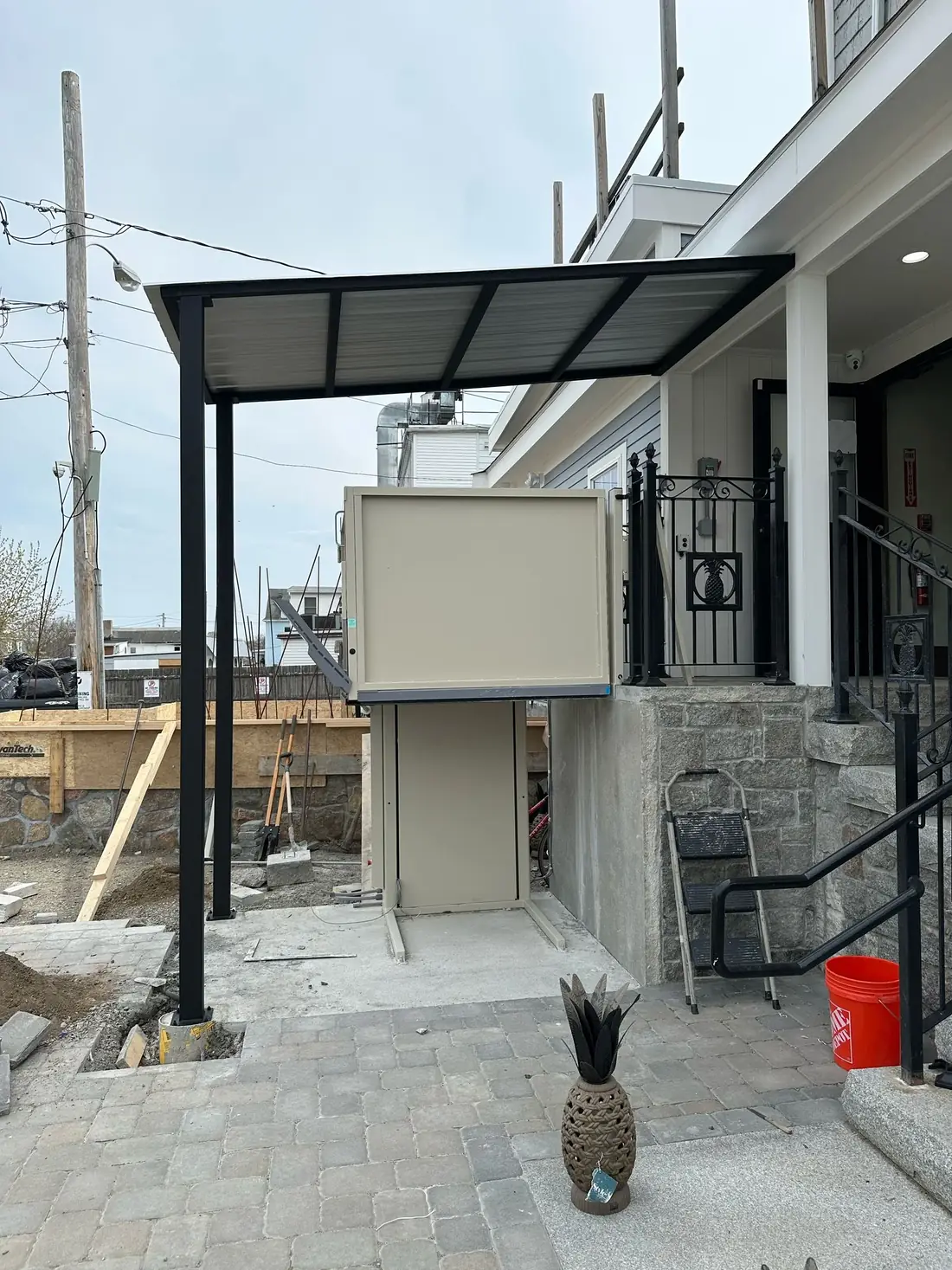 Front view of a completed residential steel canopy