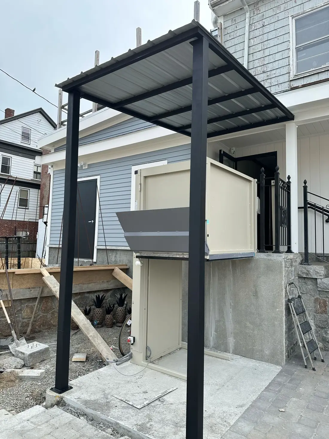 Completed steel canopy over a residential platform lift