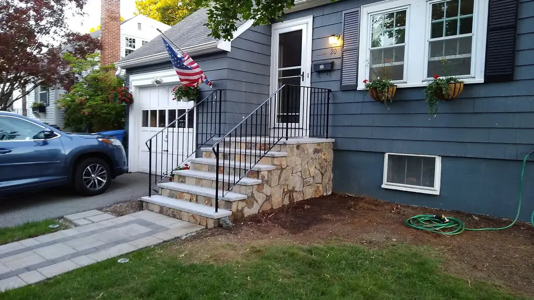 Front steps with double iron handrail
