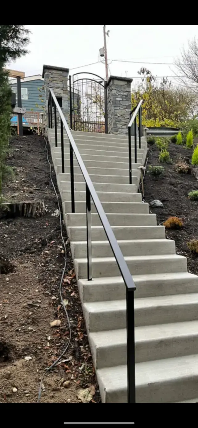 Long steel handrail run on hillside stairs