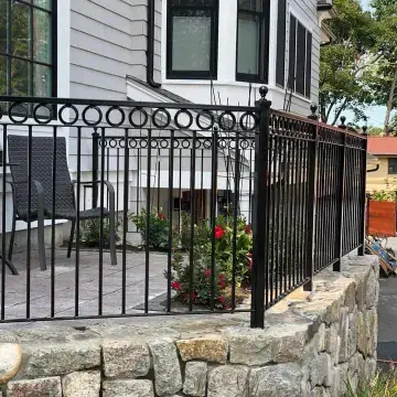 Ornamental iron fence with circle pattern around a patio