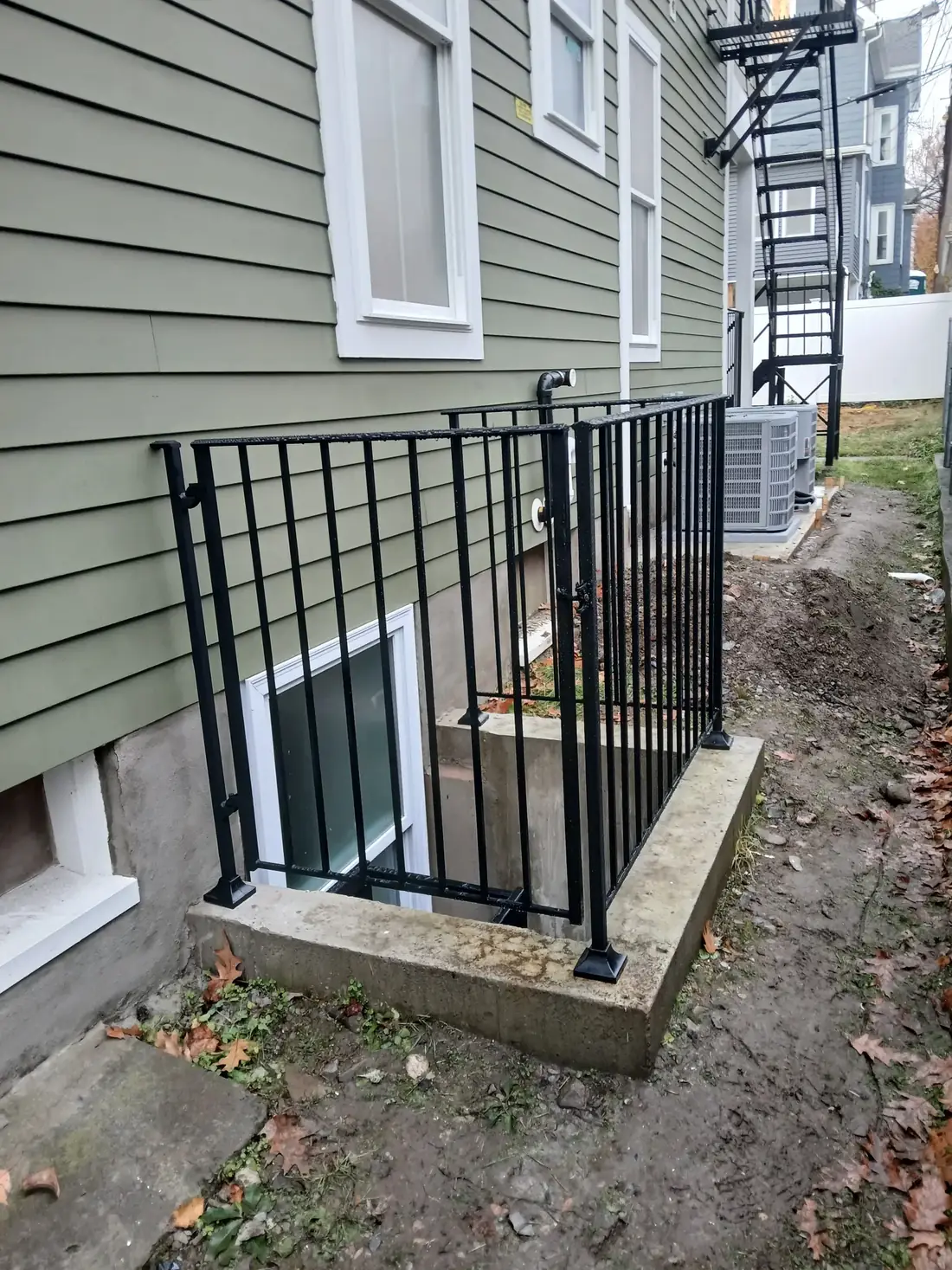 Picket style steel railing on side stairs