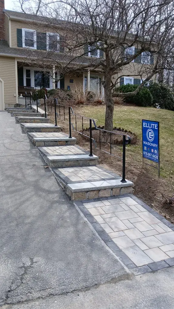 Black steel handrail along a walkway ramp