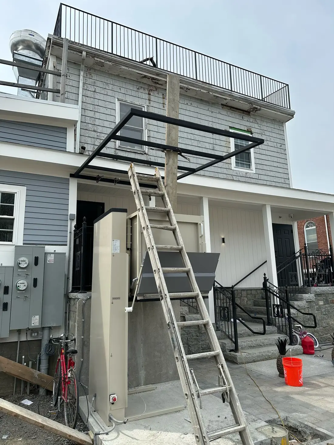 Wide view of a steel canopy under construction