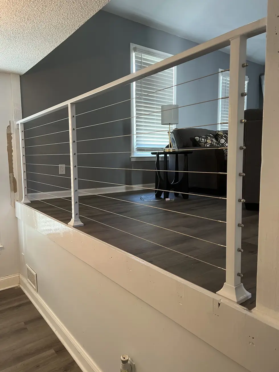 White powder-coated cable railing at an interior overlook