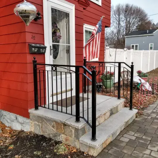 Wrought iron porch railing with double handrail