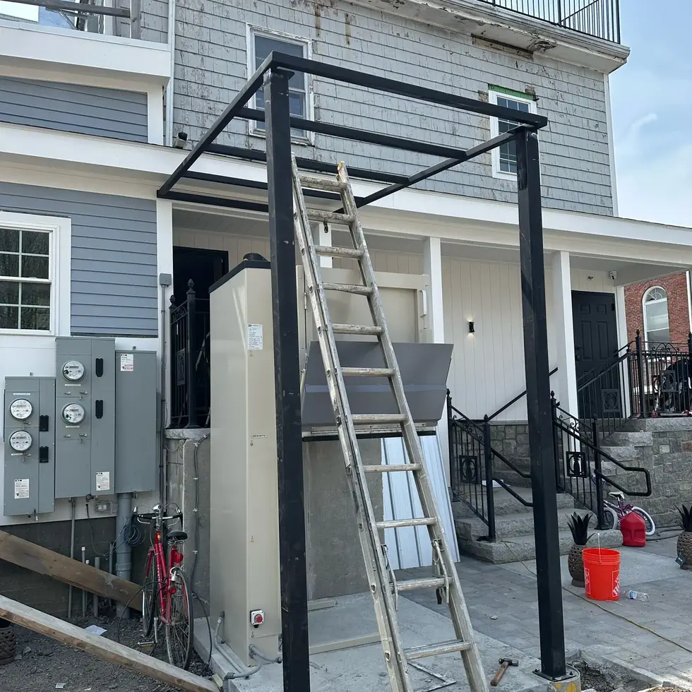 Welded structural steel frame going up on a residential jobsite